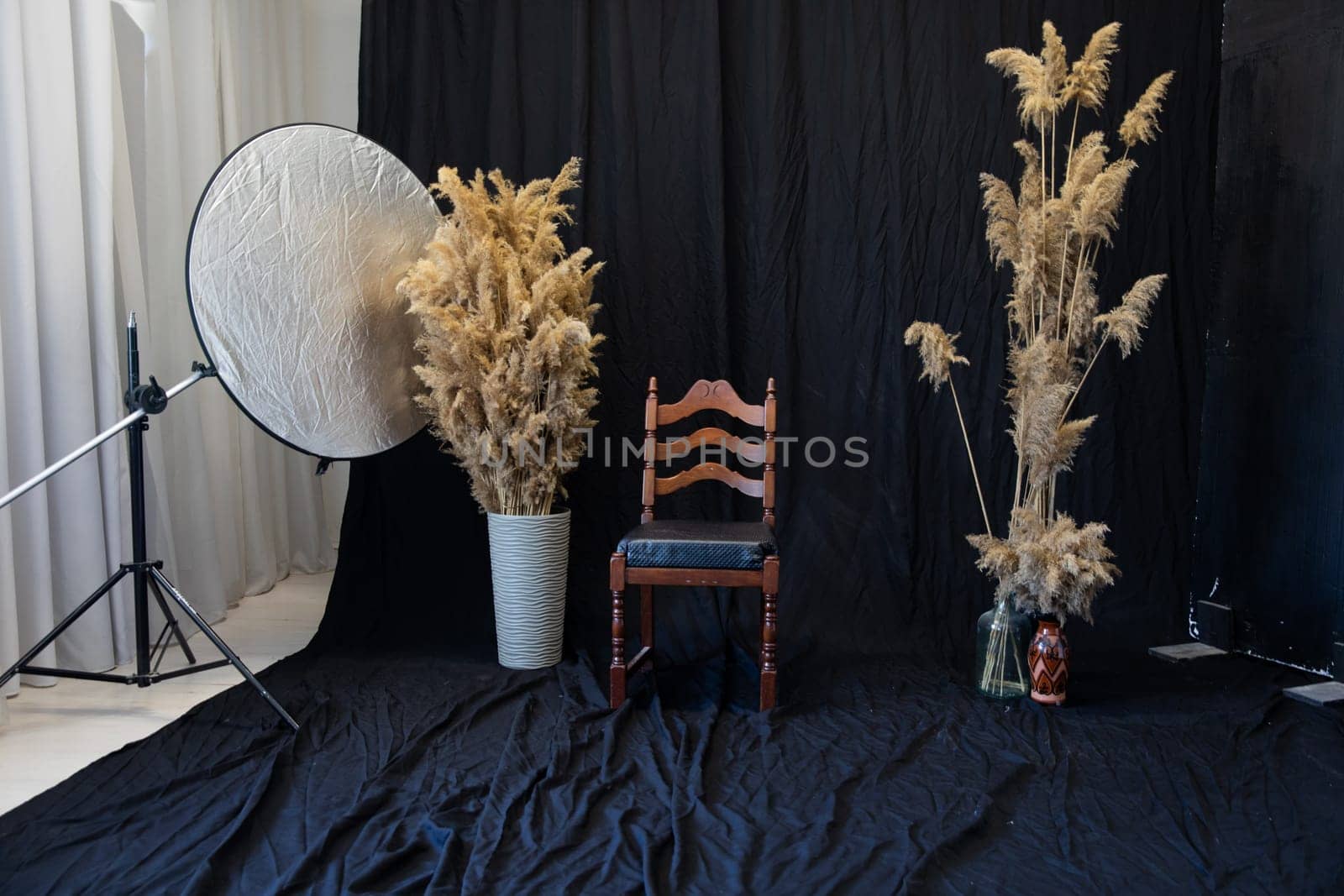 Dried flowers in chair background for photo studio