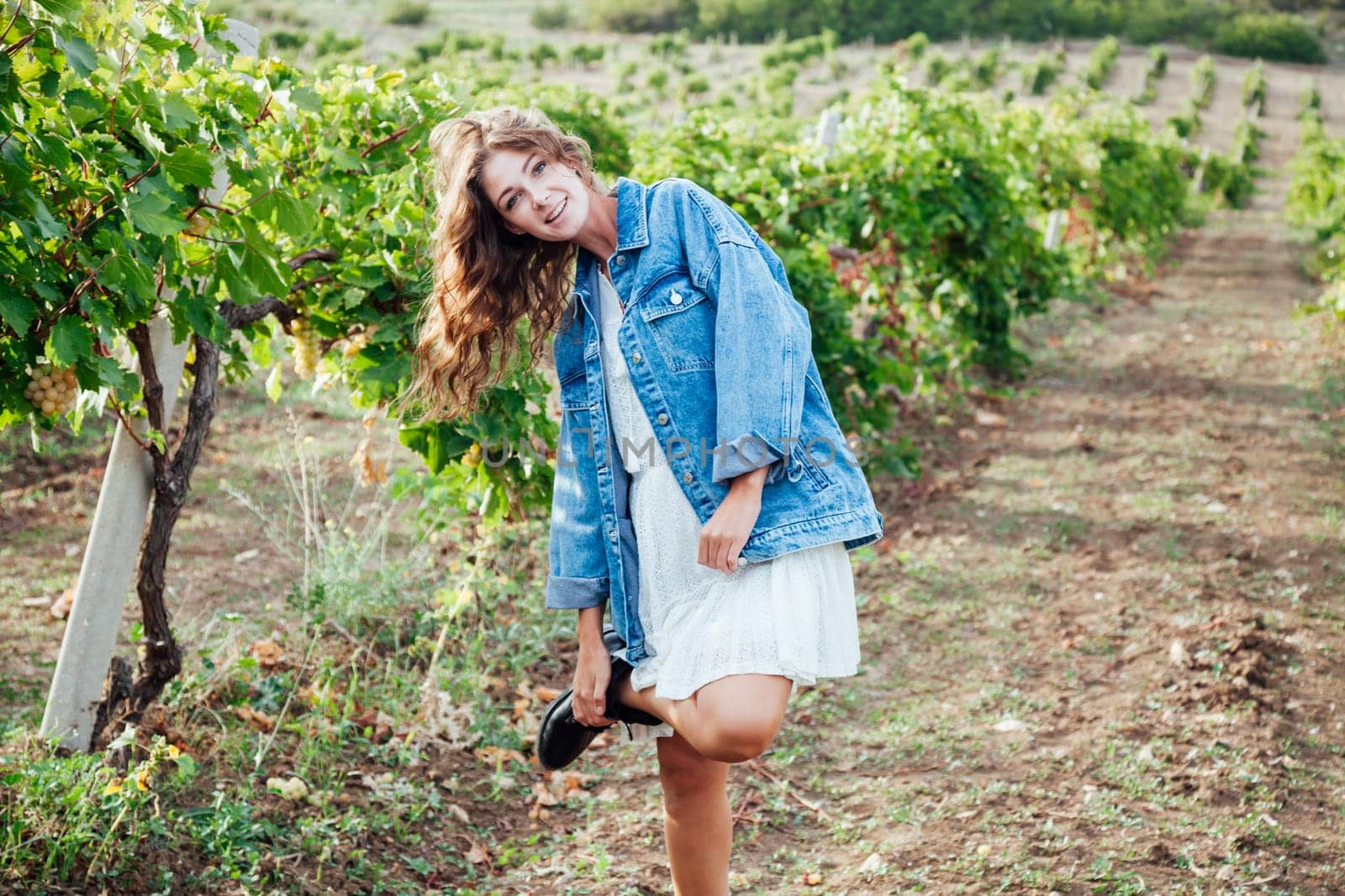 woman in vineyard garden harvesting