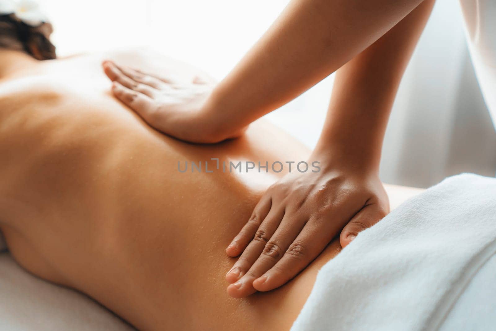 Closeup woman customer enjoying relaxing anti-stress massage. Quiescent by biancoblue