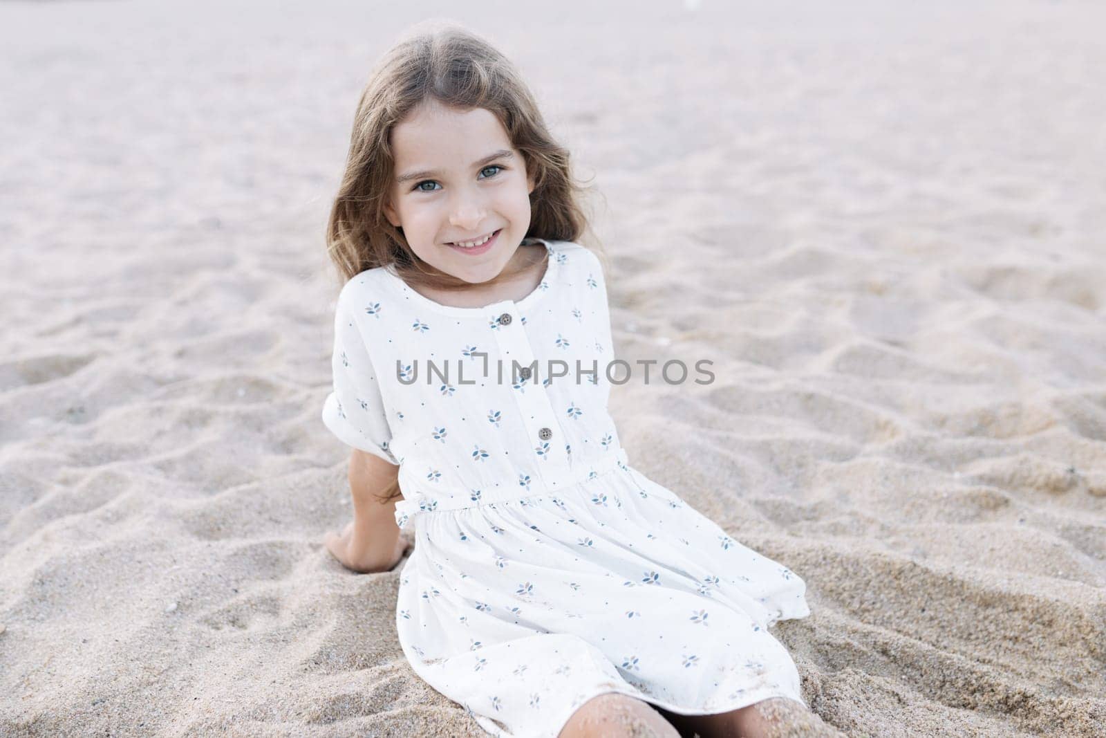 Little girl enjoying summer vacation at the sea.