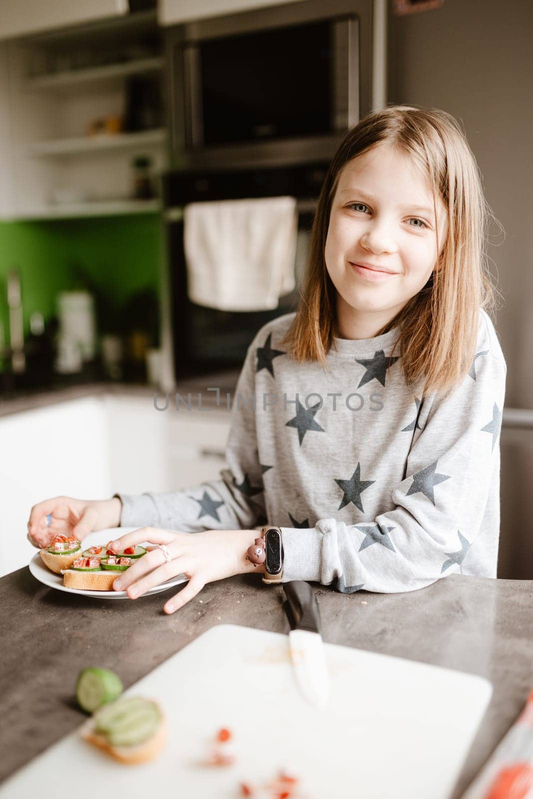 Little girl making breakfast at home by sarymsakov