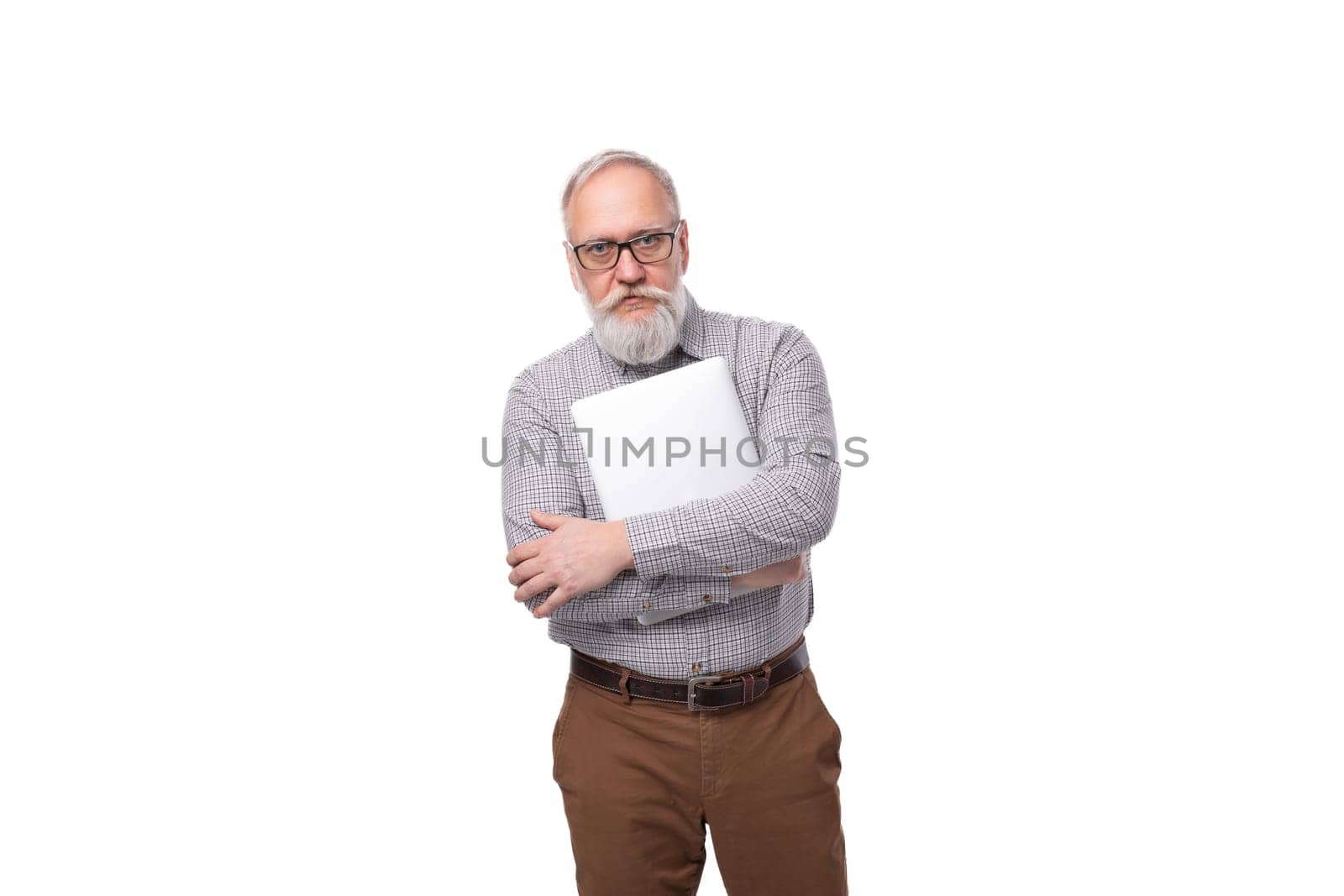A 60 year old elderly business man with a mustache and a gray beard dressed in a shirt and trousers works in the field of IT by TRMK