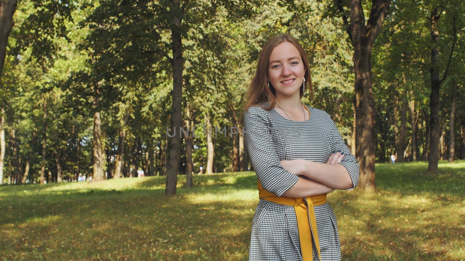 Portrait of a young 17-year-old girl in the park