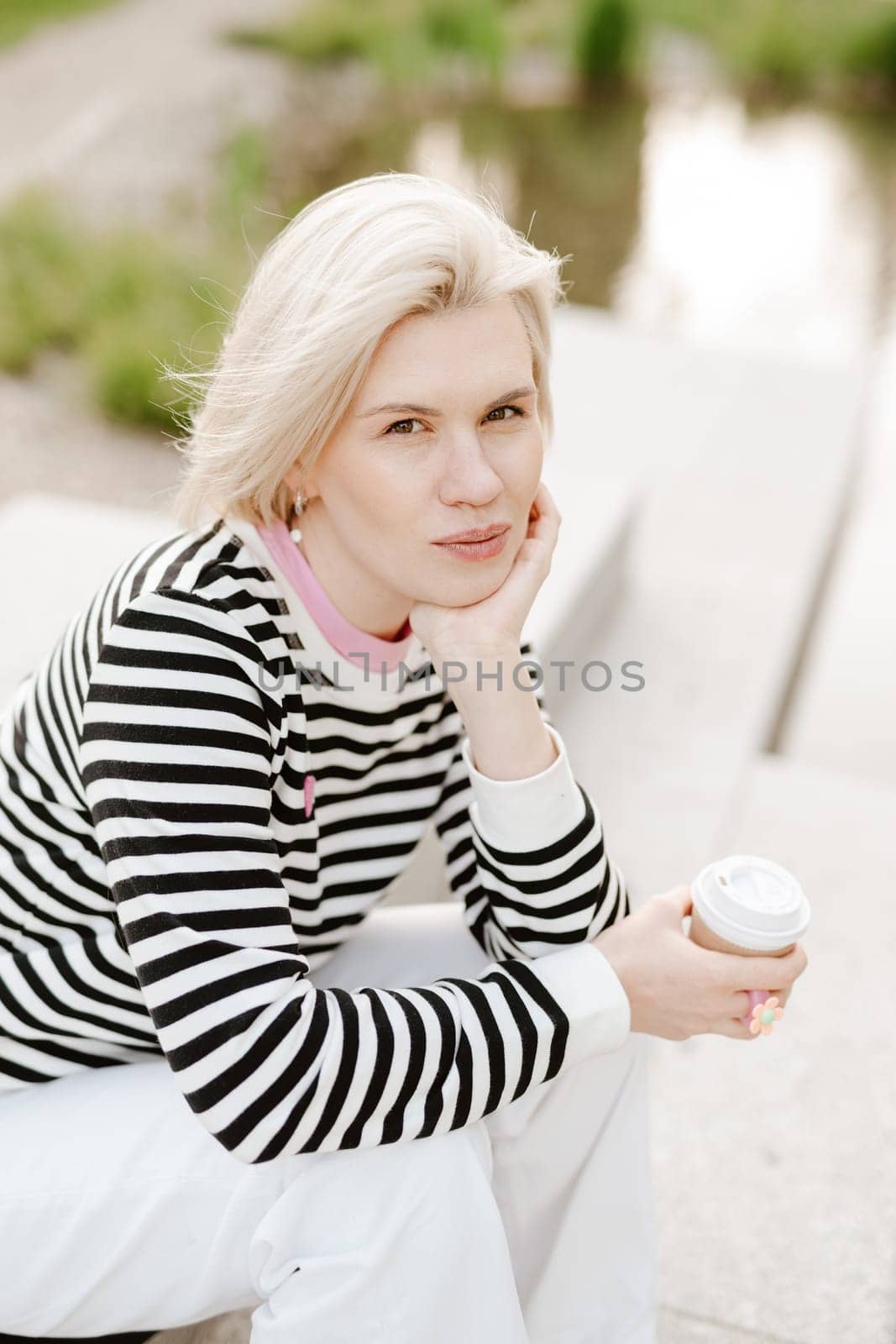 Young beautiful woman person are happy and enjoy with coffee drink in the morning at park by sarymsakov