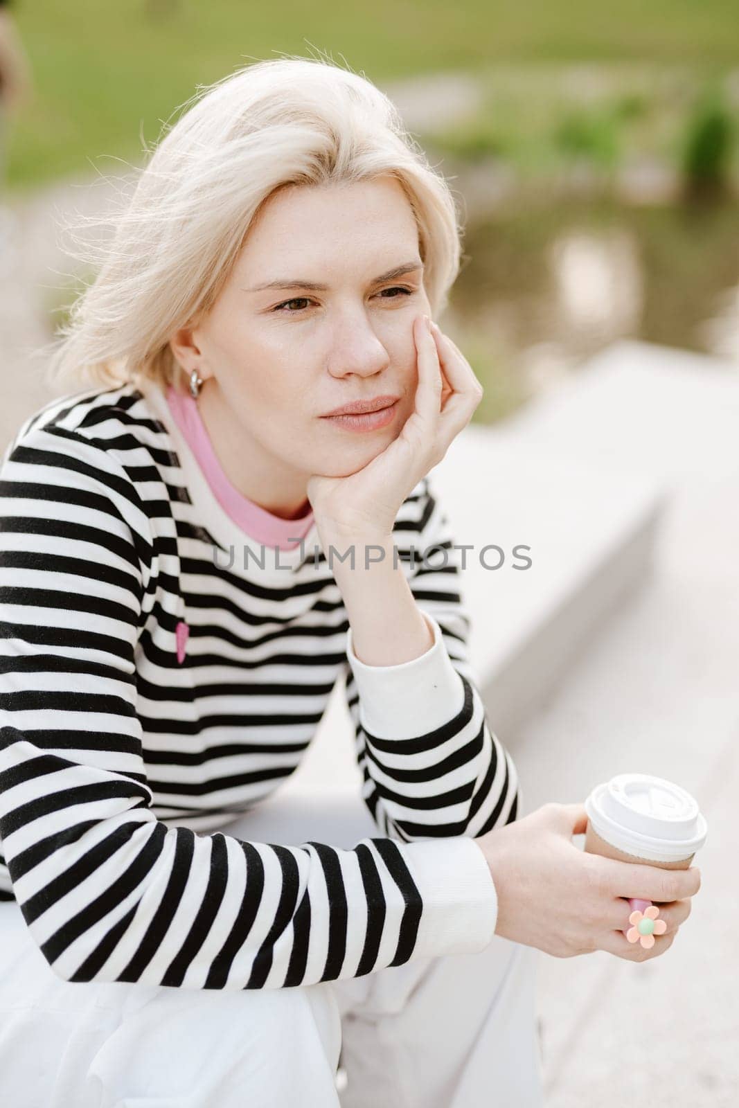 Young beautiful woman person are happy and enjoy with coffee drink in the morning at park, relax lifestyle by holding coffee or tea cup at nature outdoor park, smile pretty girl with freedom time