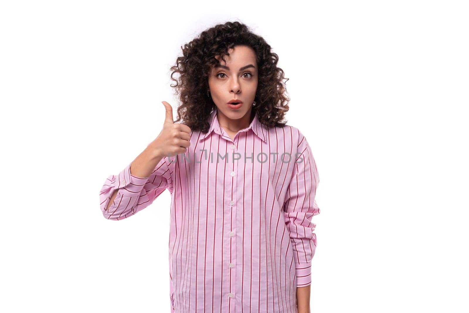 young authentic slim curly brunette model woman wearing pink striped shirt.