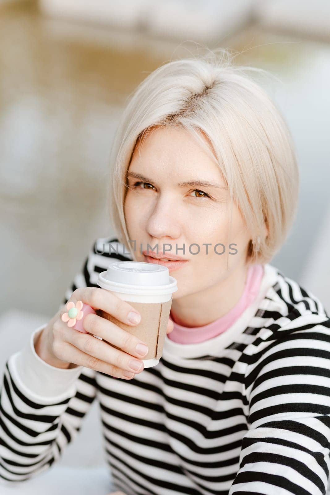 Young beautiful woman person are happy and enjoy with coffee drink in the morning at park, relax lifestyle by holding coffee or tea cup at nature outdoor park, smile pretty girl with freedom time
