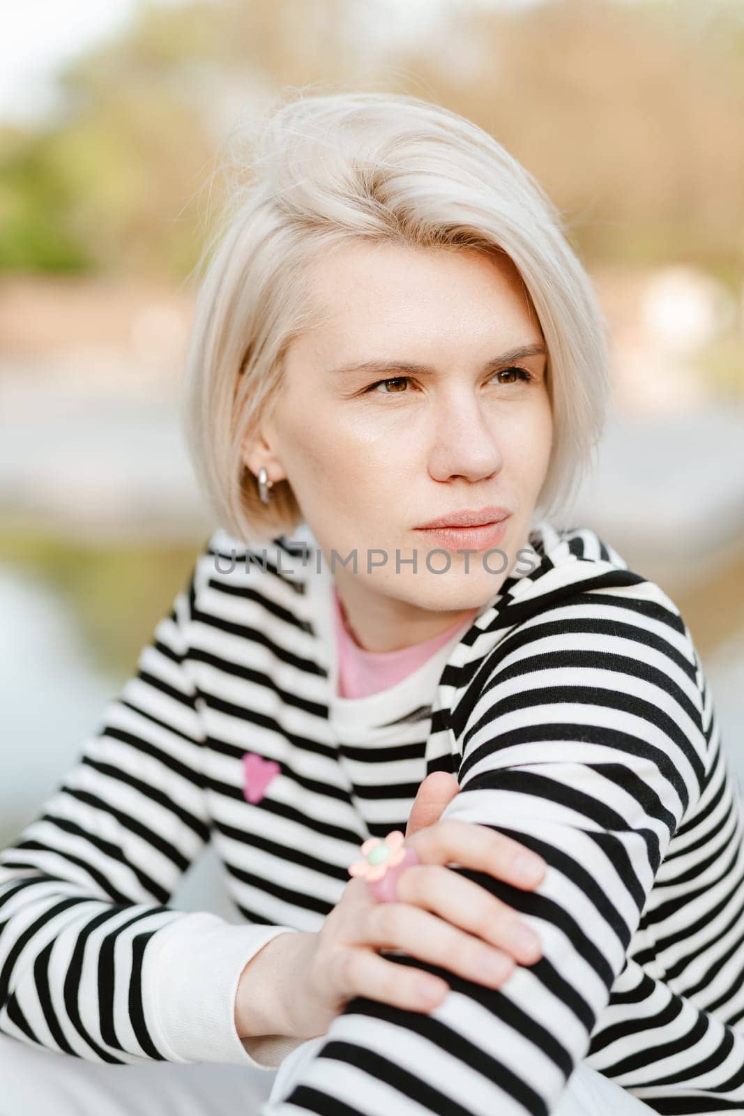 Photo of young attractive girl happy positive smile rest relax summer season park outdoors. by sarymsakov