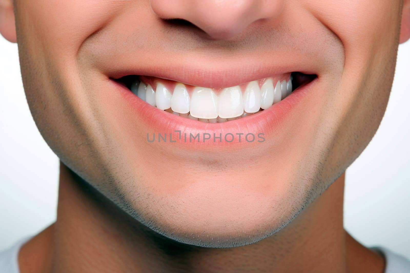 Closeup of mans smile with clean white teeth