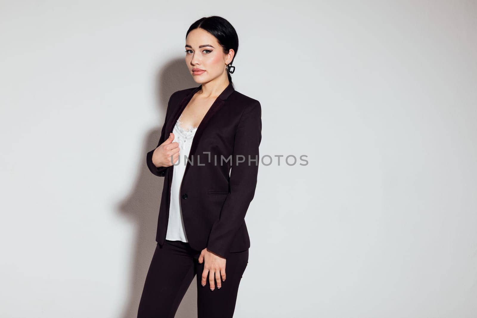 Business woman in brown business suit in office