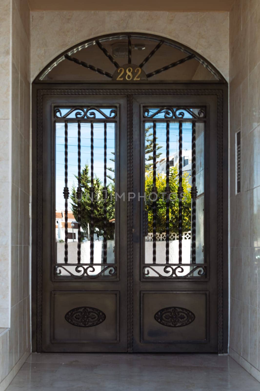 Old entrance door to a house, door to a residential building, closed door, entrance to a residential building,. High quality photo