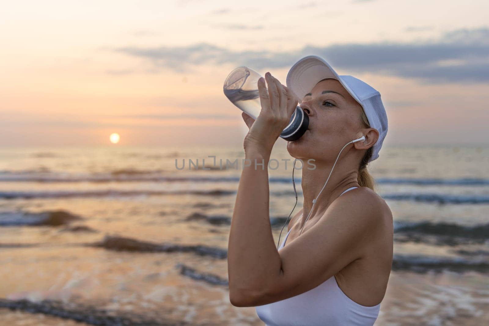 a girl of European appearance in sportswear stands outdoors, portrait of a girl in sportswear. High quality photo