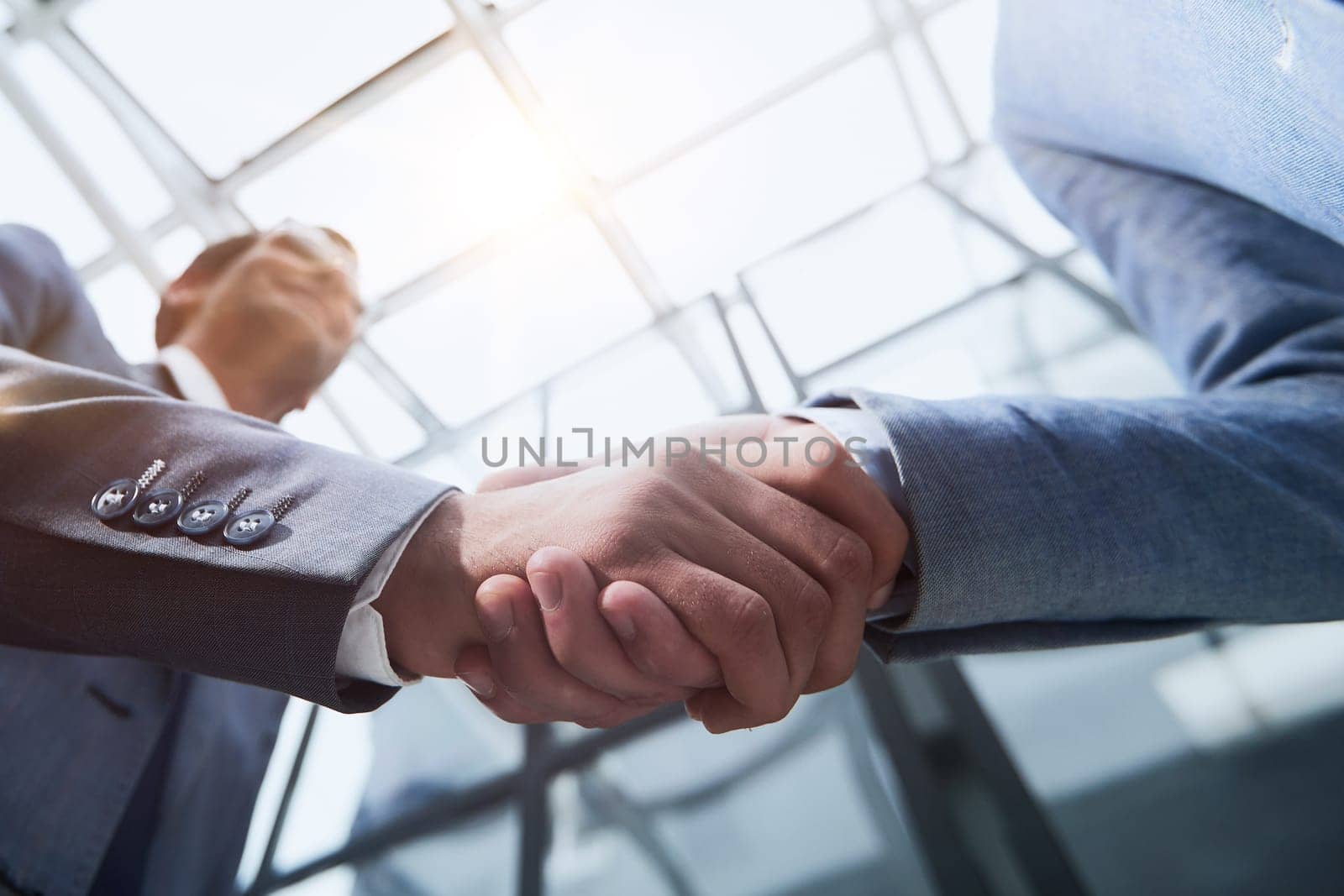 Business partners shake hands in the office