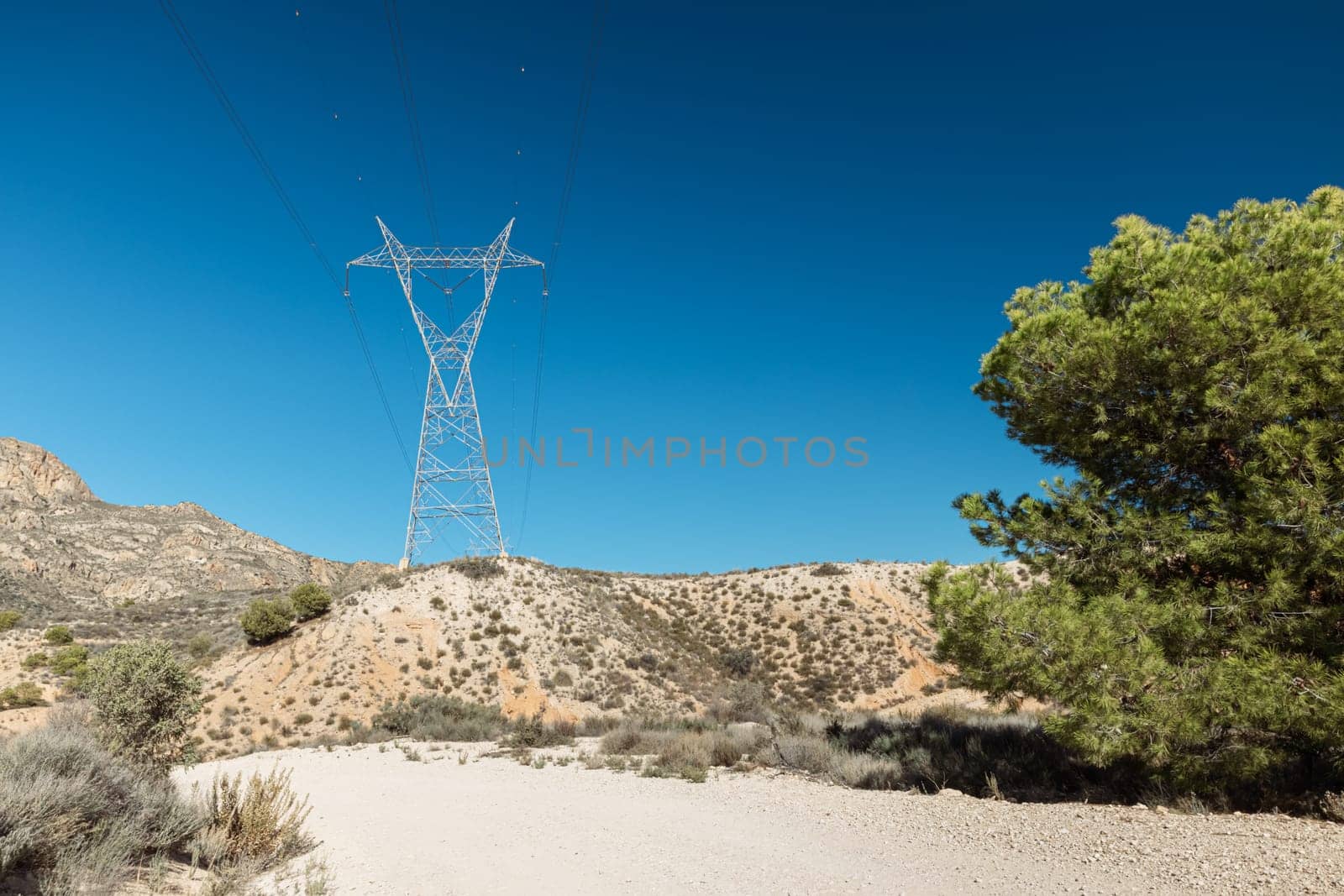 Picturesque landscape scene, Power line pylon in mountainous area by PopOff