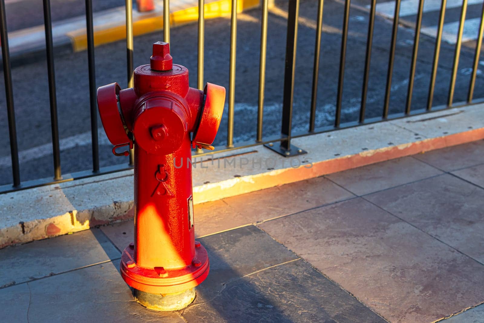 A Fire Hydrant, Waterplug, or Firecock on City Street, Red Steel Pipe to Extinguish Fires by PopOff