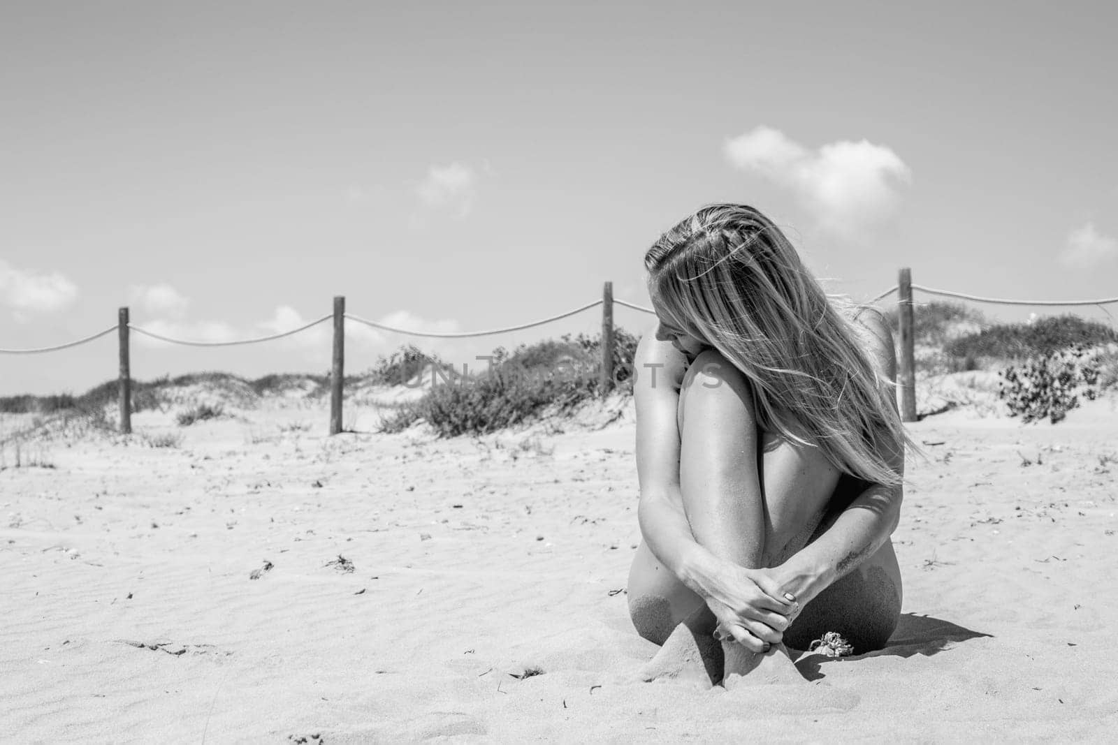 girl takes a photo on the beach , there is a place for an inscription,photo is black and white by PopOff
