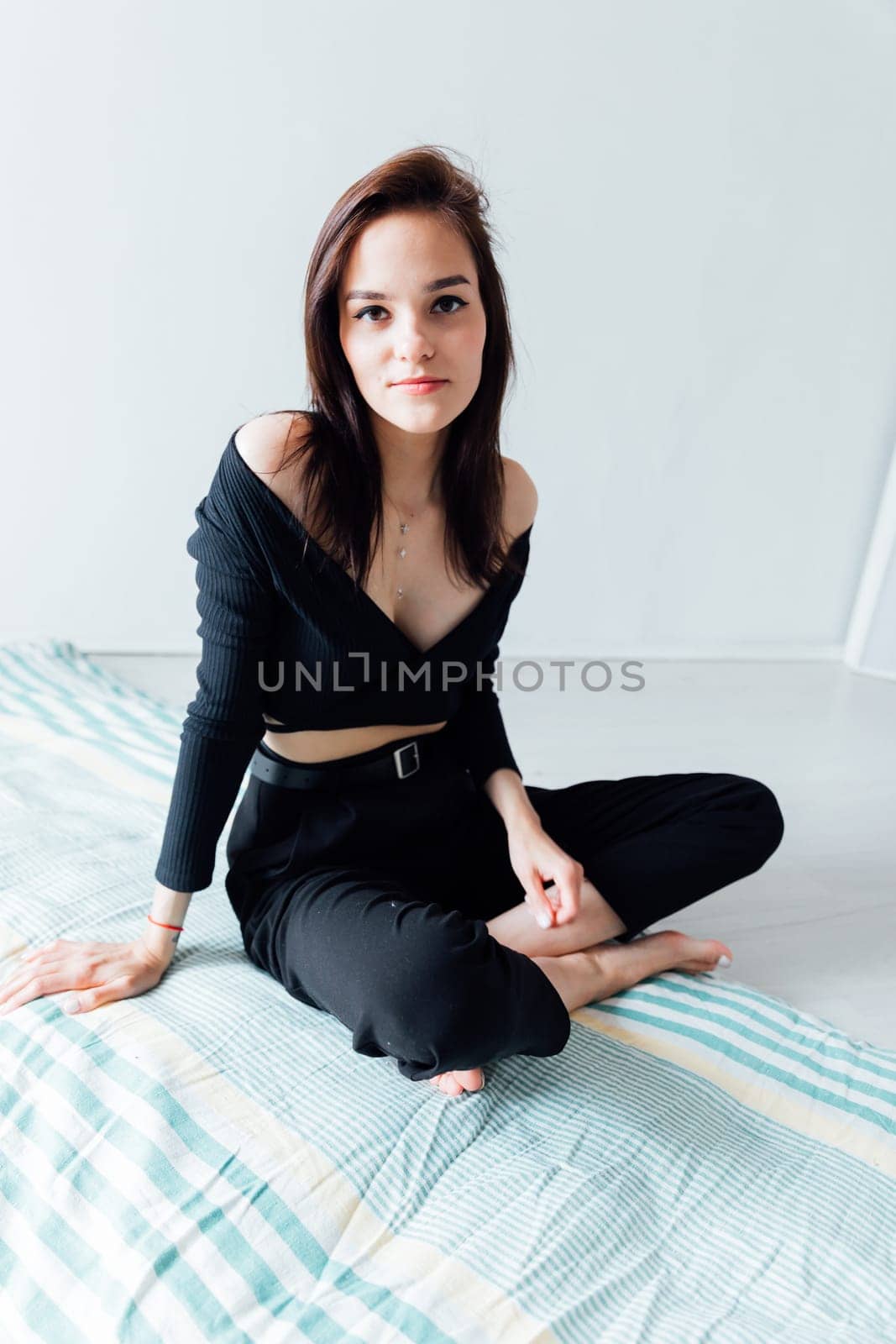 woman lying on sleeping mattress on the floor