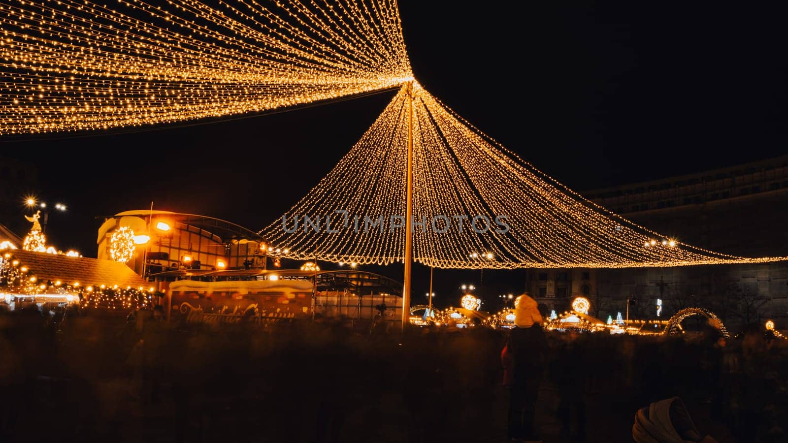 People in front of Christmas tree at Bucharest Christmas Market