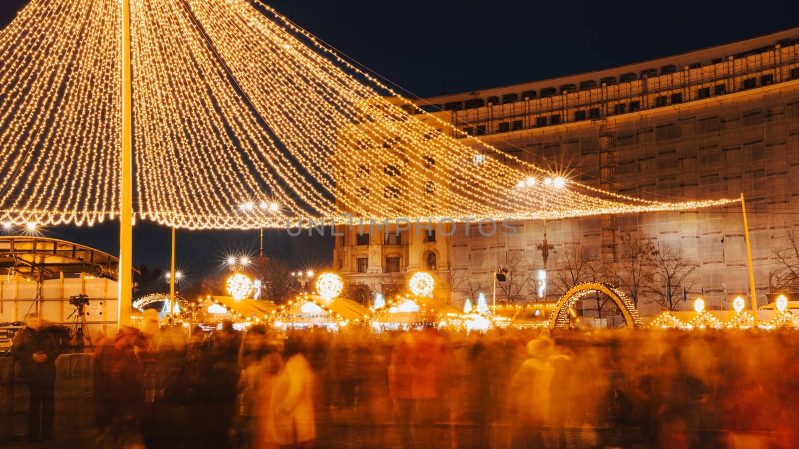 People in front of Christmas tree at Bucharest Christmas Market