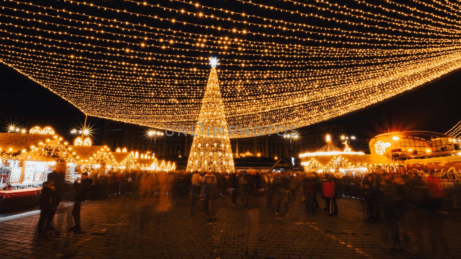 People in front of Christmas tree at Bucharest Christmas Market