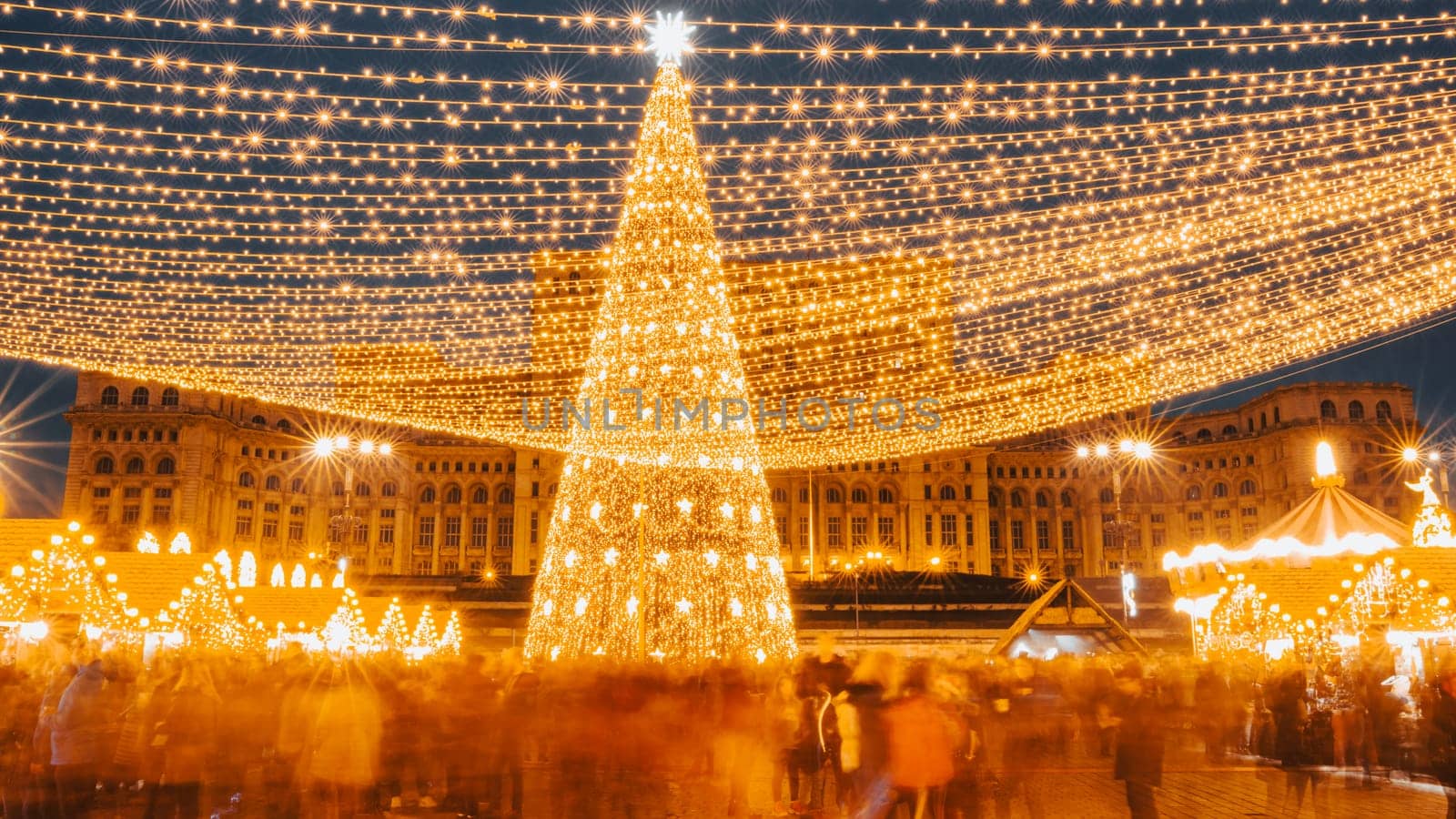 People in front of Christmas tree at Bucharest Christmas Market