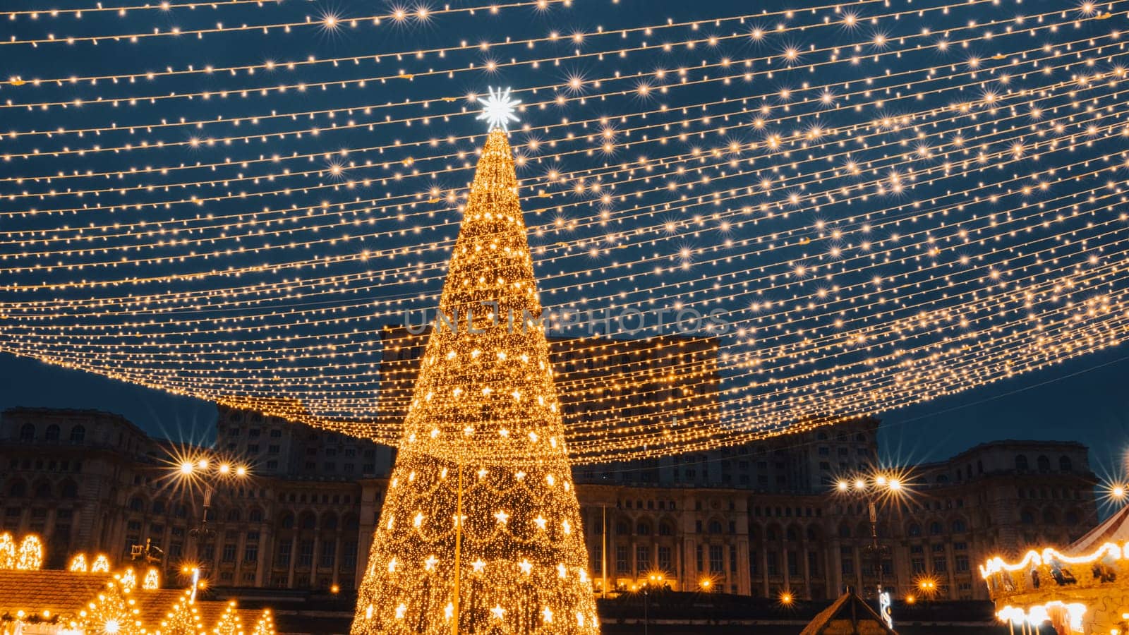 People in front of Christmas tree at Bucharest Christmas Market