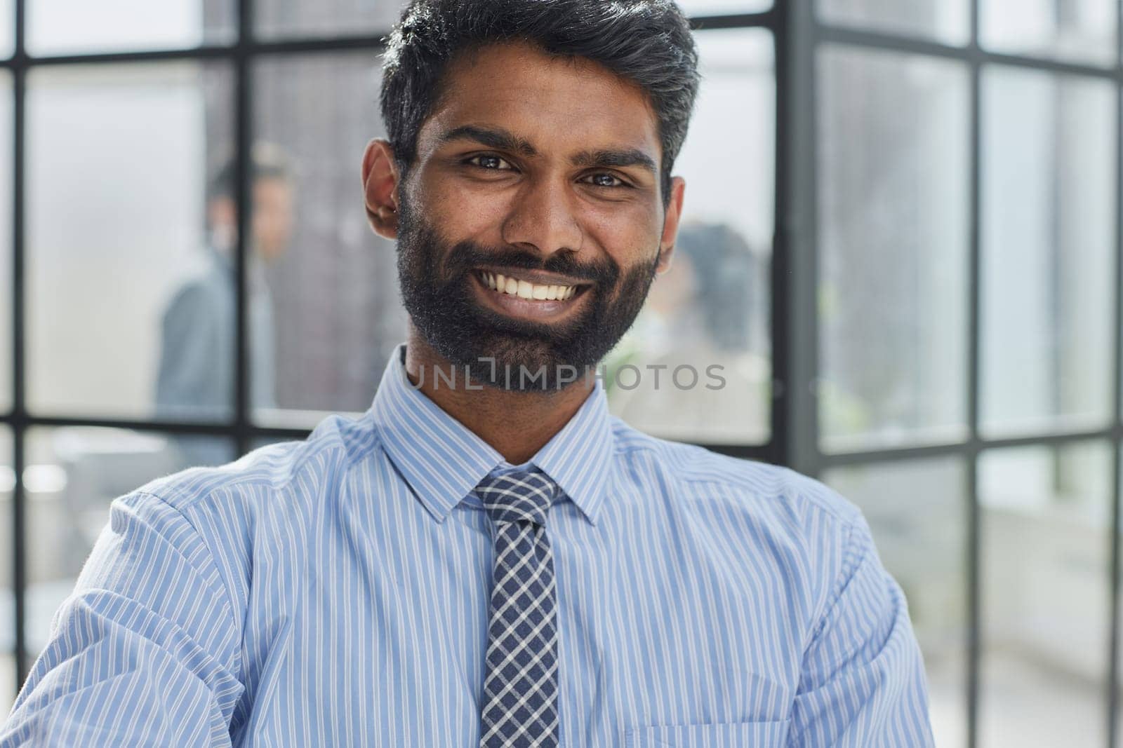 Close-up photo portrait of successful and happy businessman, male investor beard looking at camera