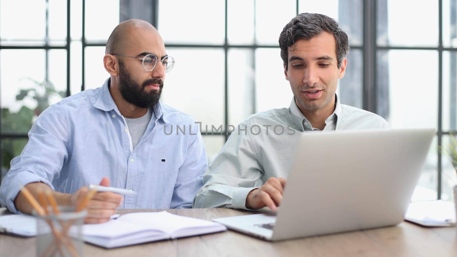 man working on the table with laptop in a new office
