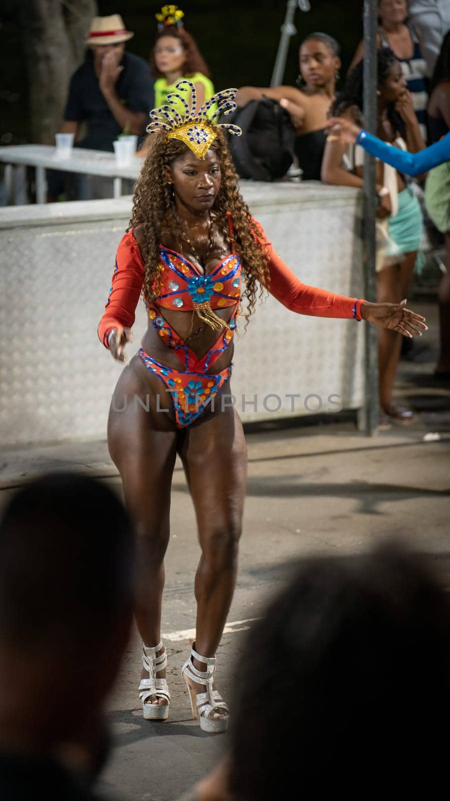 Performer in vibrant attire participates in a cultural festival in Juiz de Fora, Brazil, on Feb 21, 2023