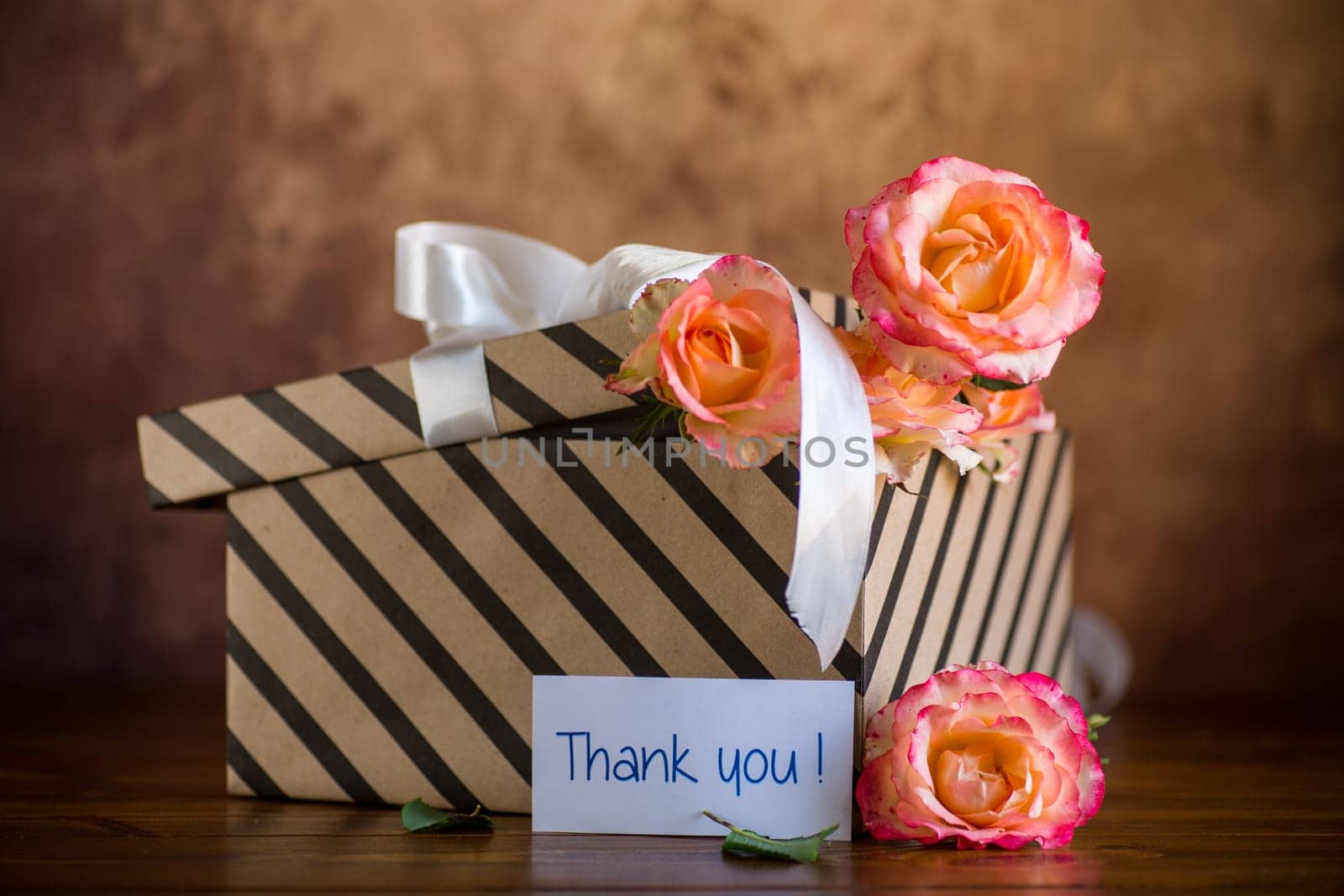 gift box with ribbons and beautiful roses inside. by Rawlik