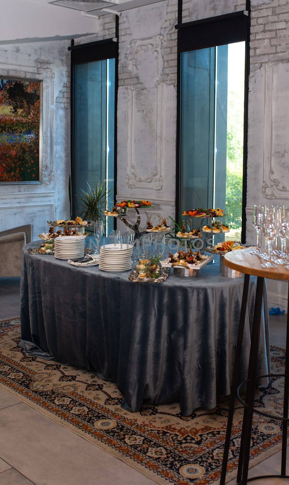 various snacks on stands on the buffet table. self-service at the event.