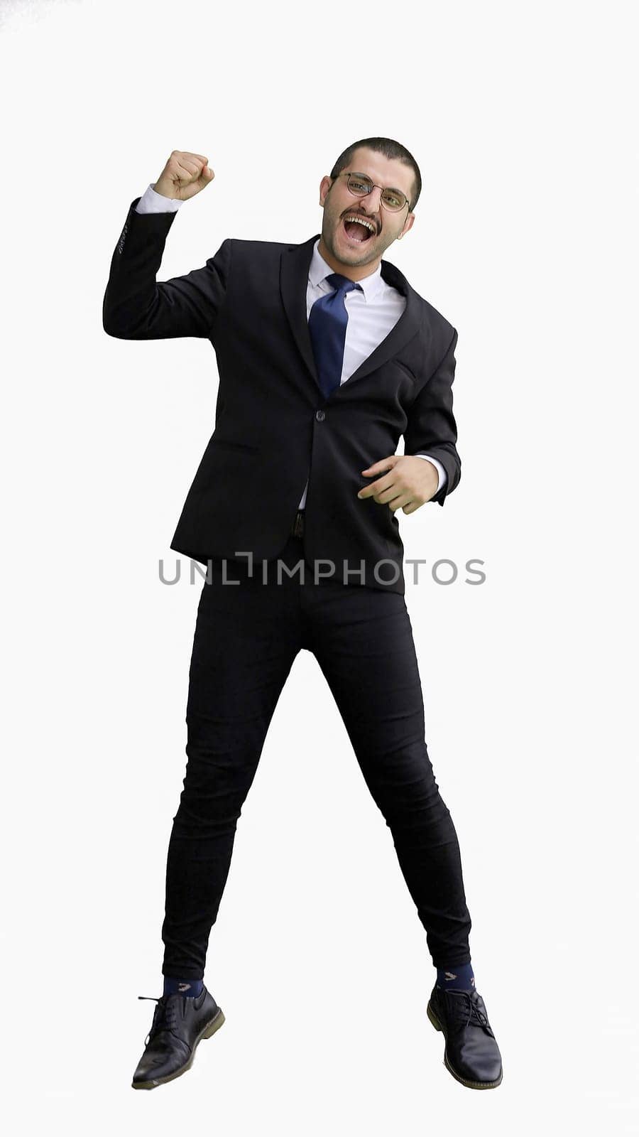 man in full growth. isolated on white background jumping rejoices.