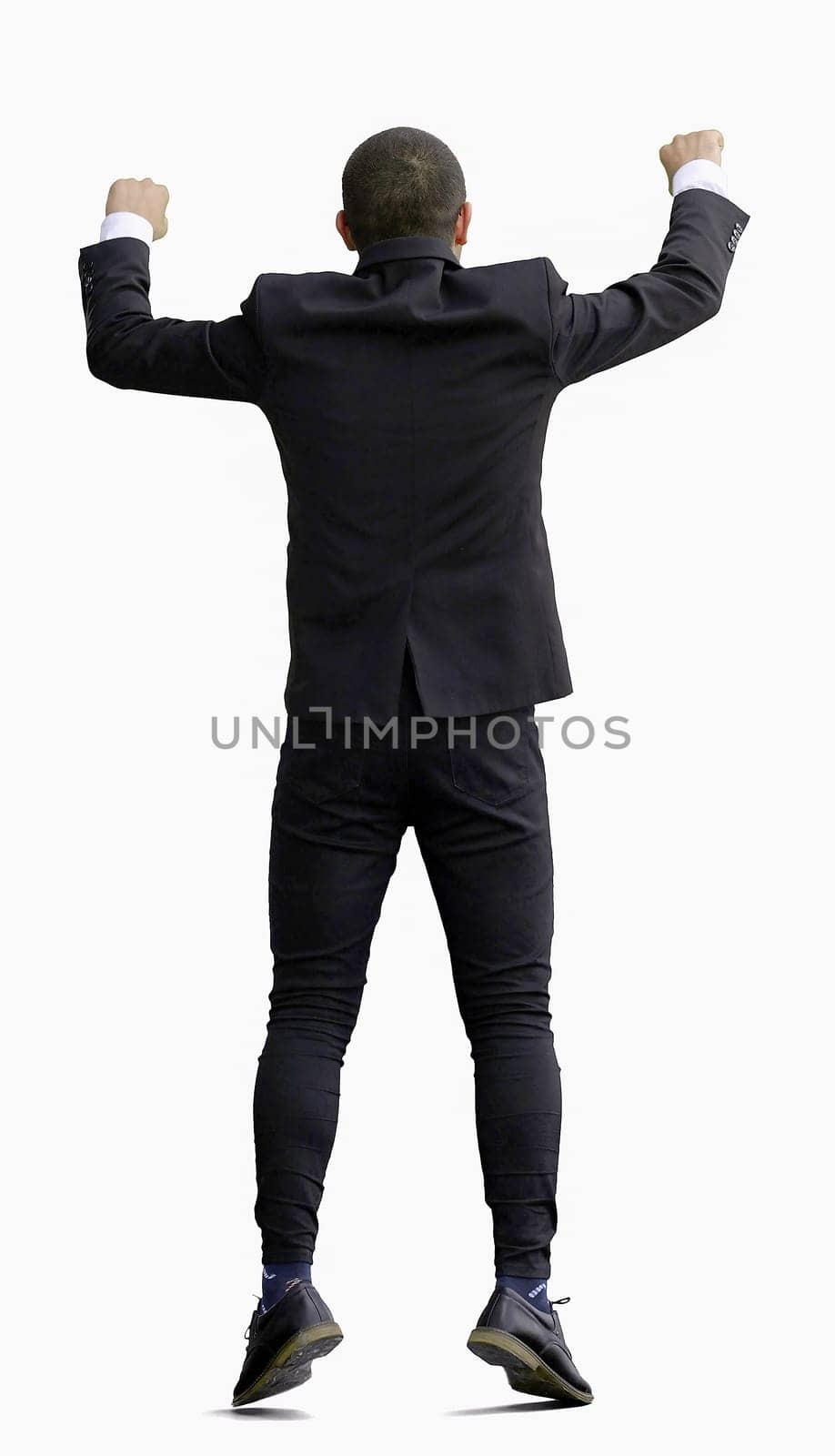 man in full growth. isolated on white background jumping rejoices.