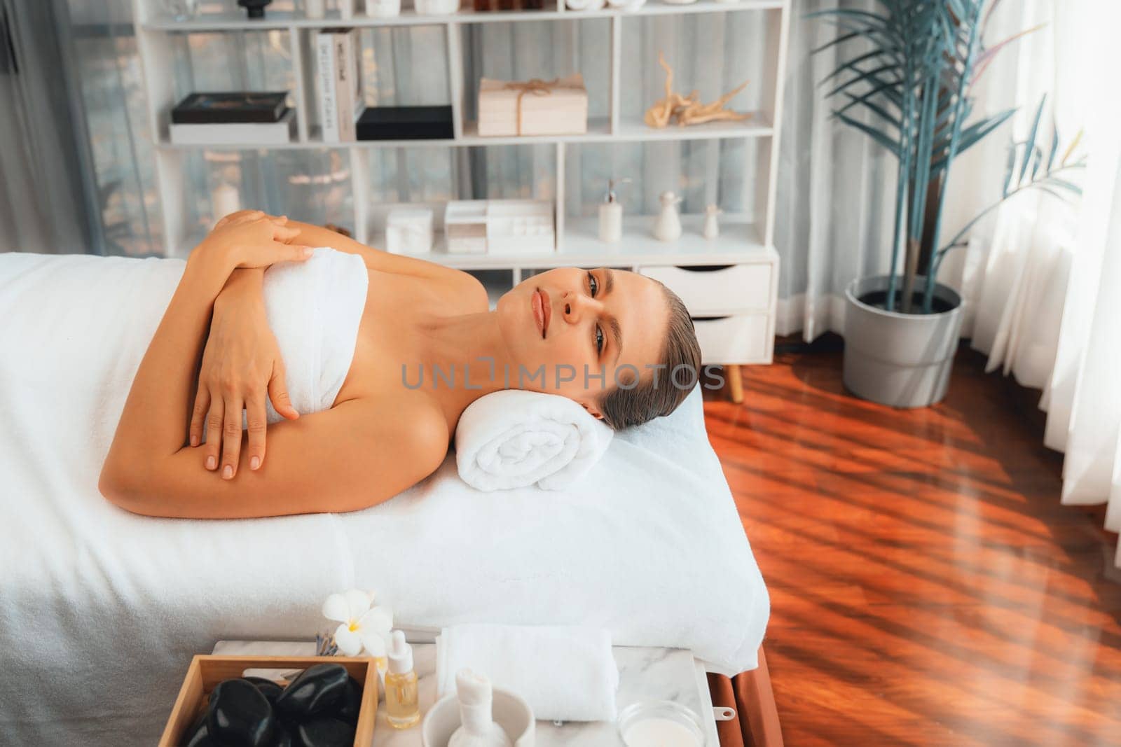 Caucasian woman customer enjoying relaxing anti-stress massage. Quiescent by biancoblue