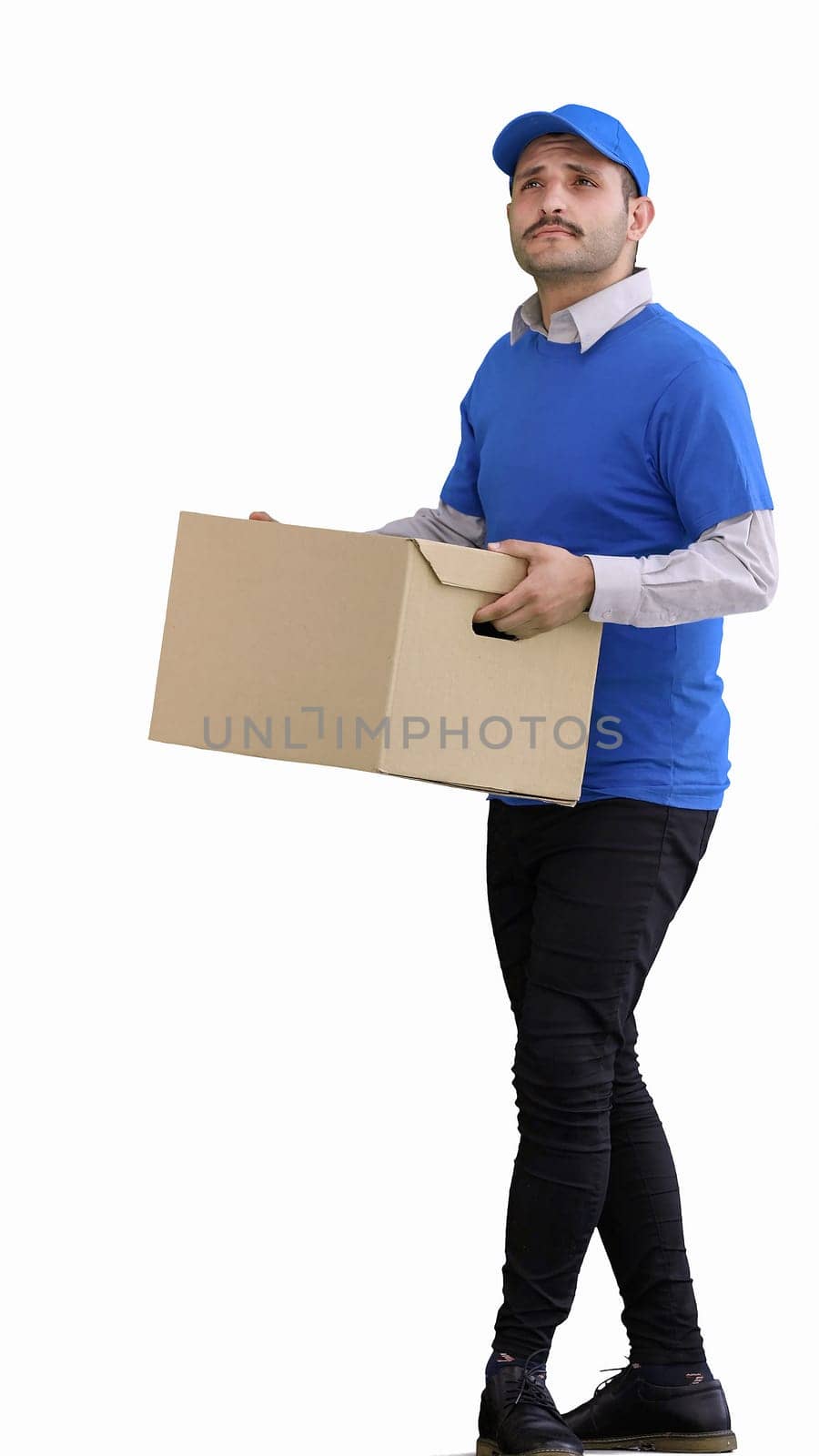 full-length male courier holding a box on a green background by Prosto