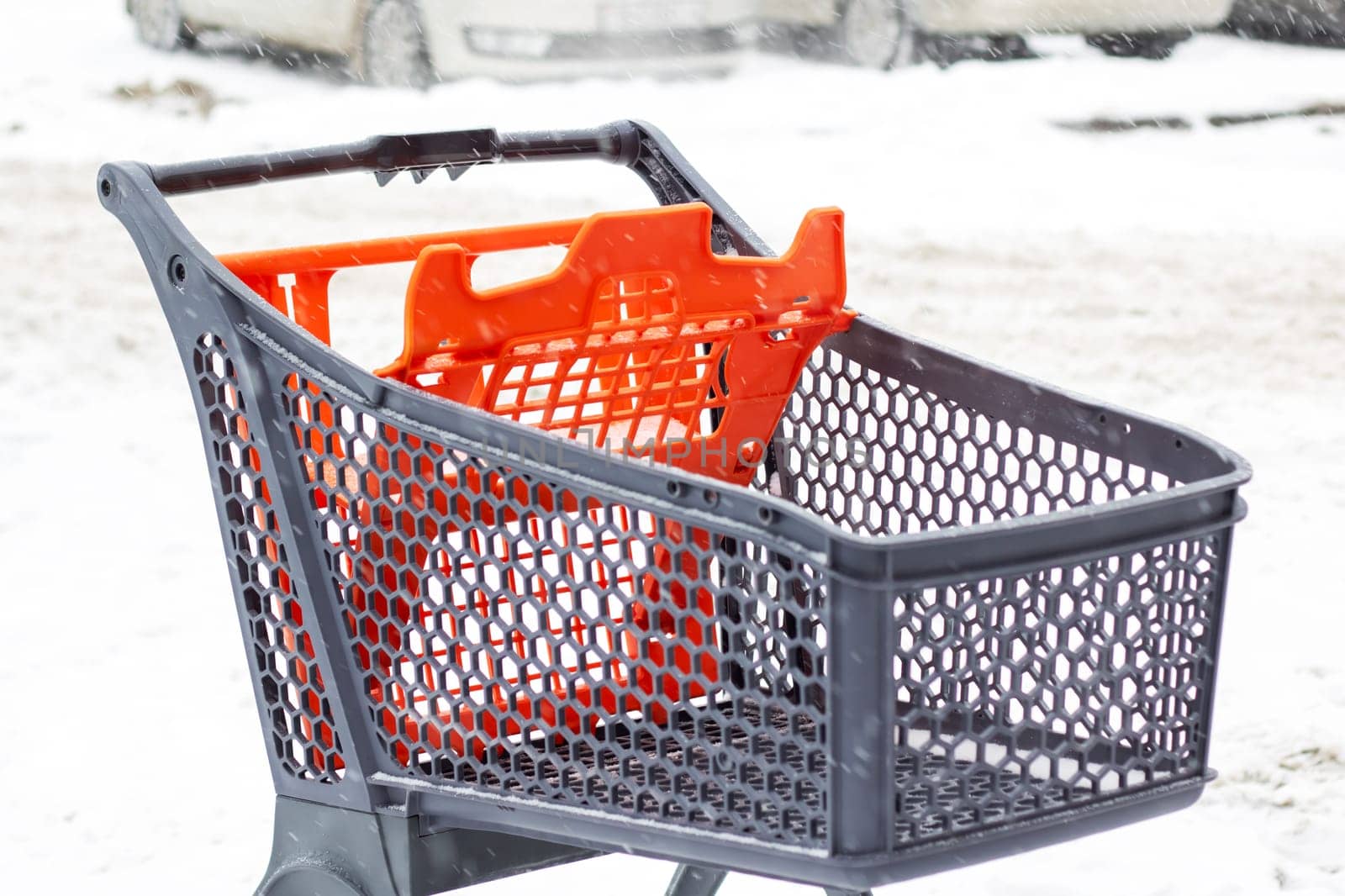 Shopping cart for outdoor shopping in the snow close up
