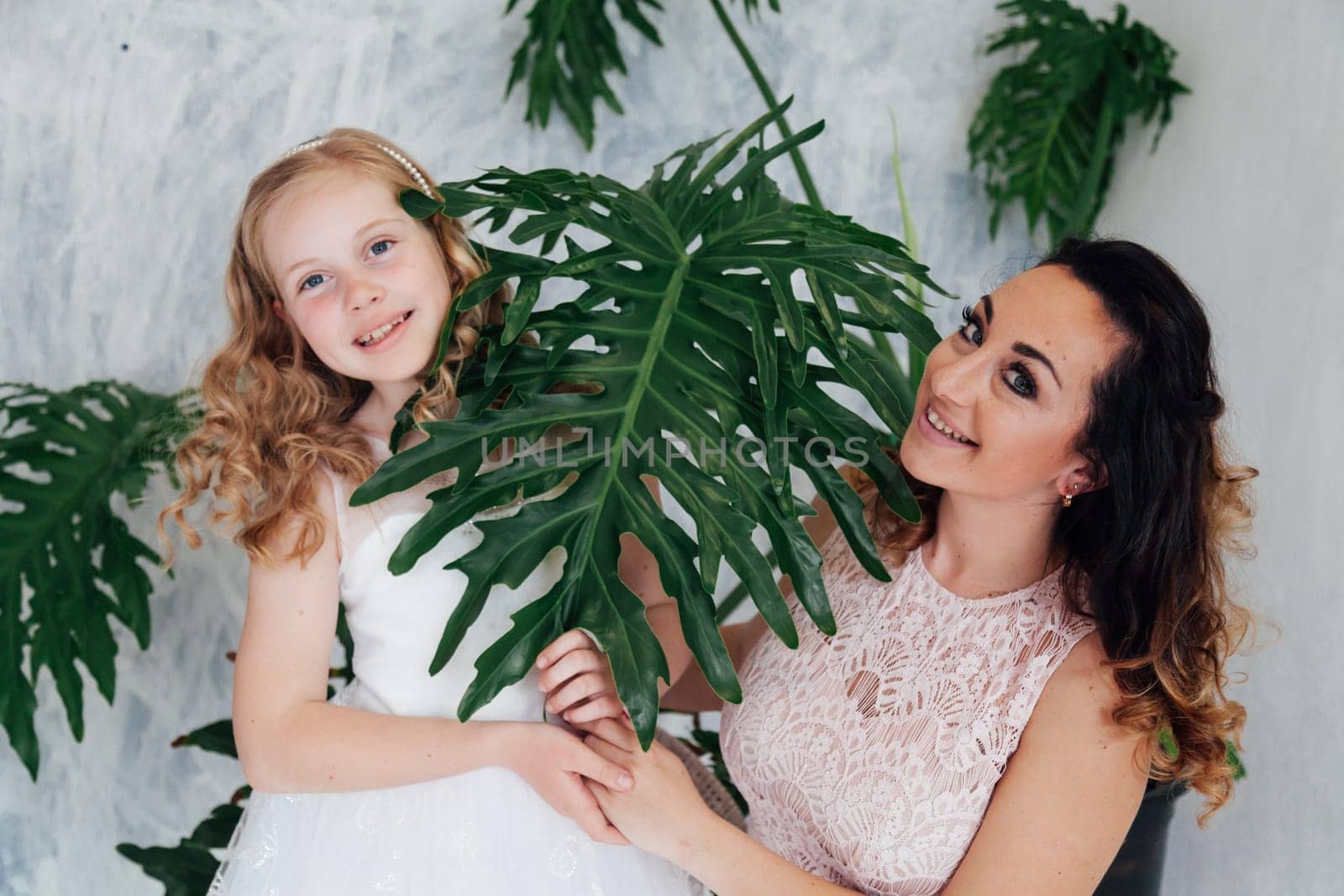 Family mom with daughter in light dresses