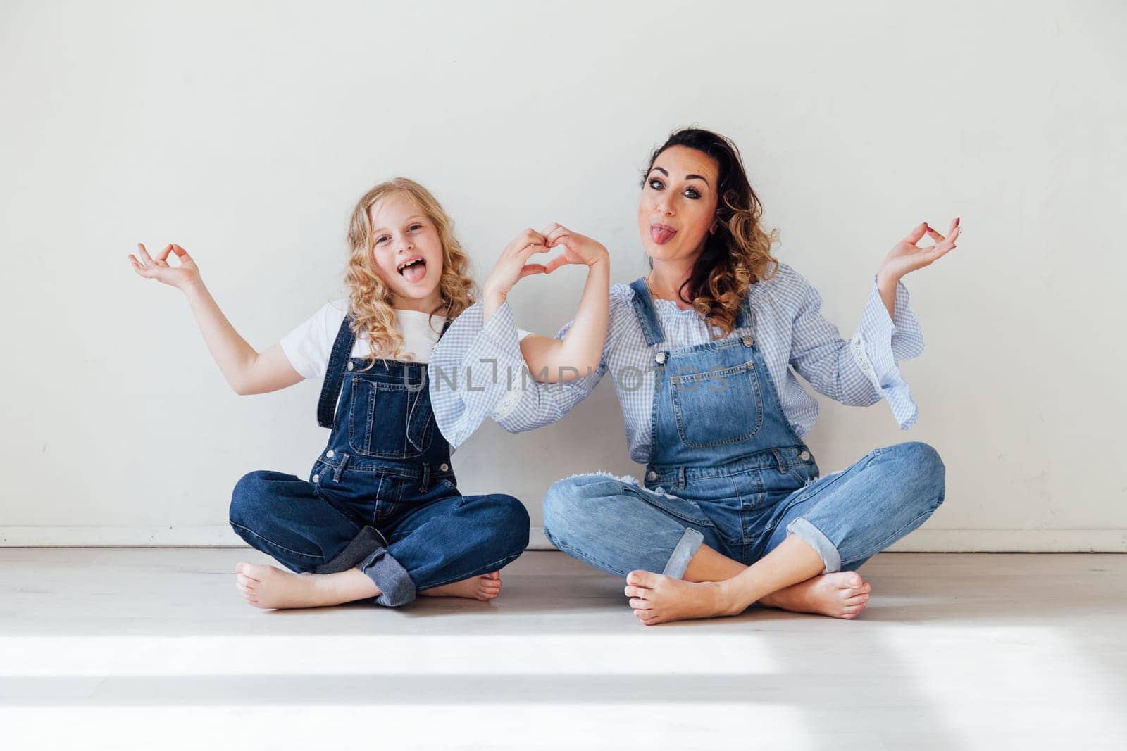 Family mom with daughter in denim clothes