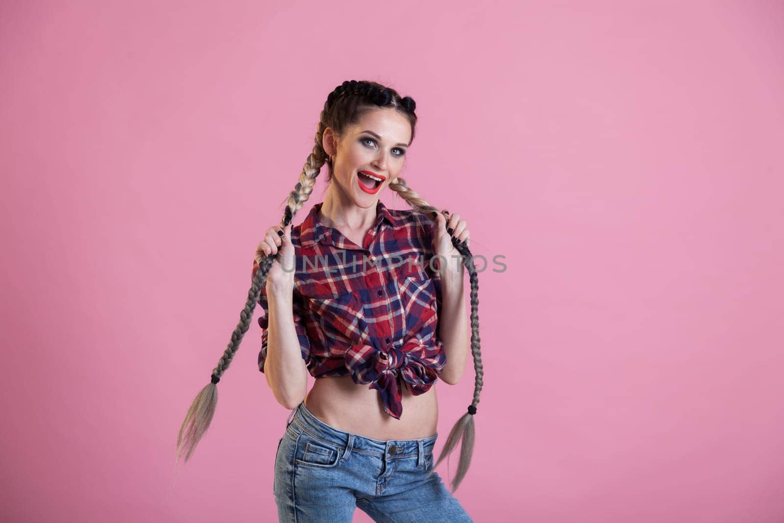 portrait of a fashionable woman with two braids