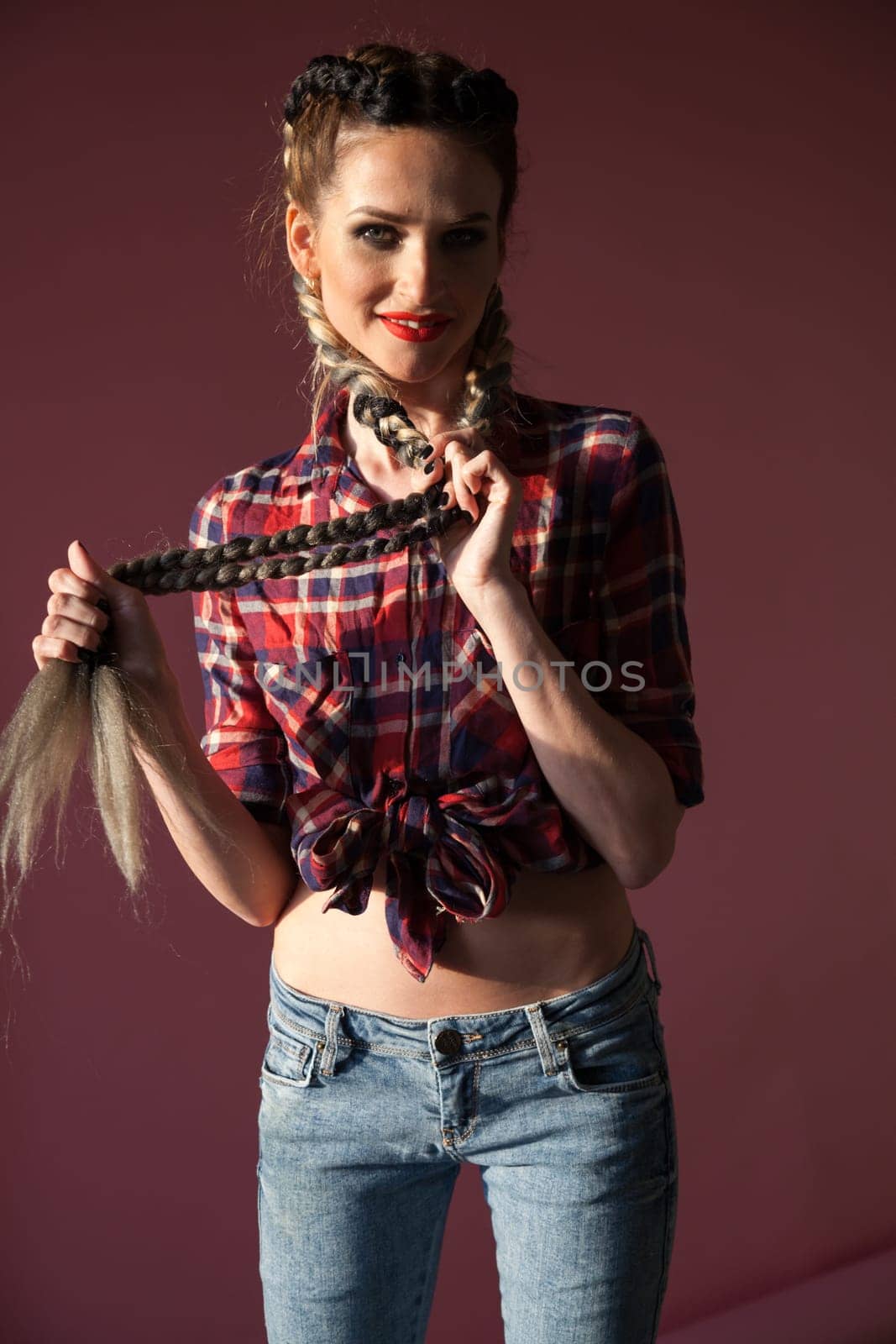 portrait of a fashionable woman with two braids