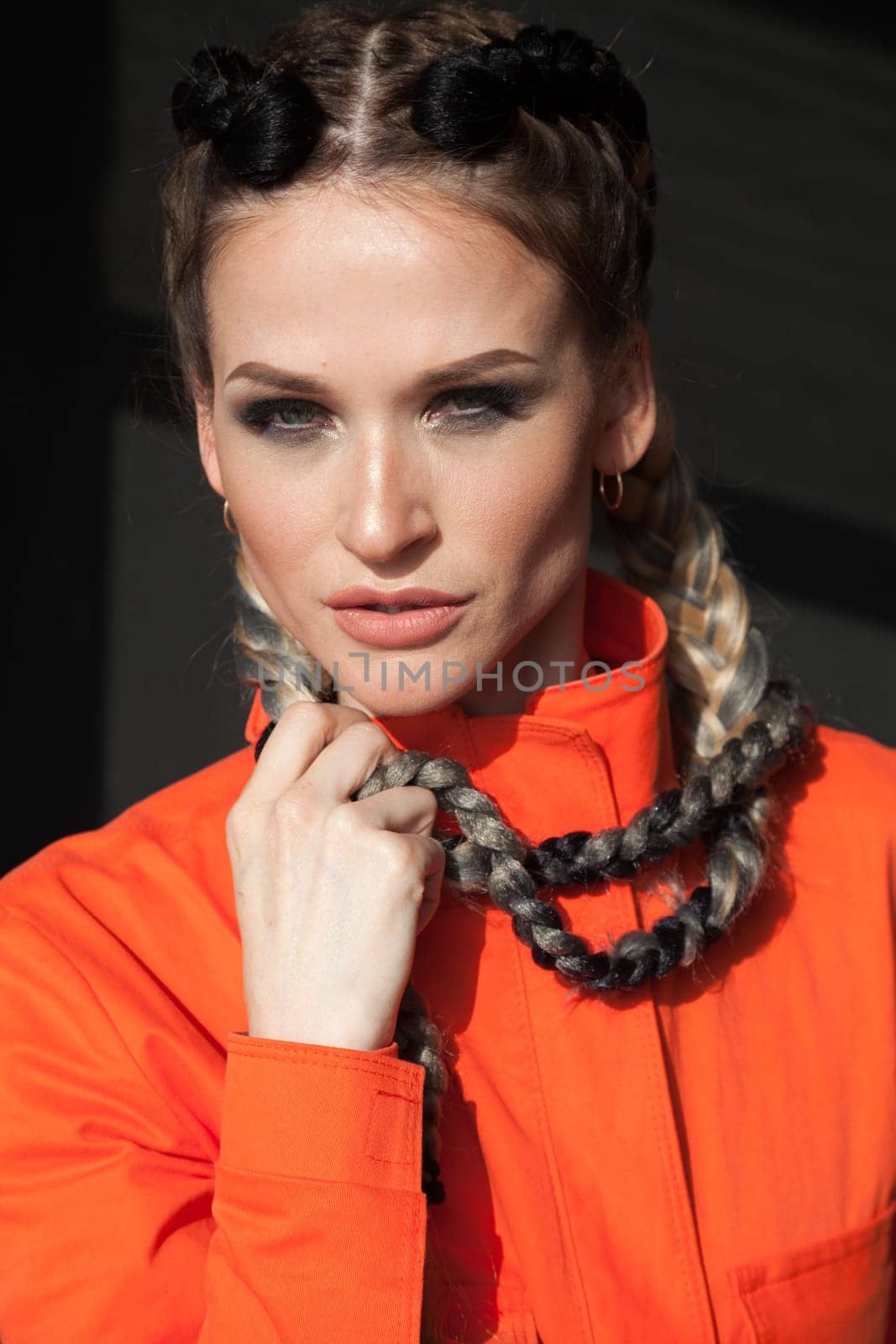 portrait of a beautiful woman in working orange clothes by Simakov