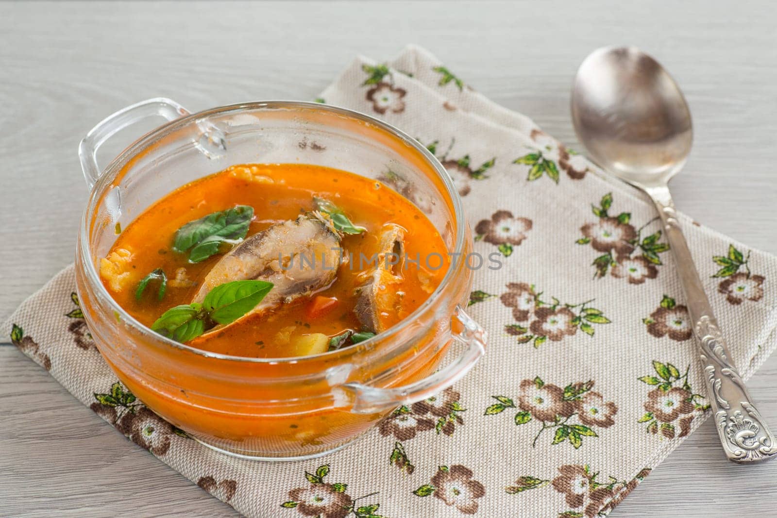 vegetable tomato soup with fish in a plate by Rawlik