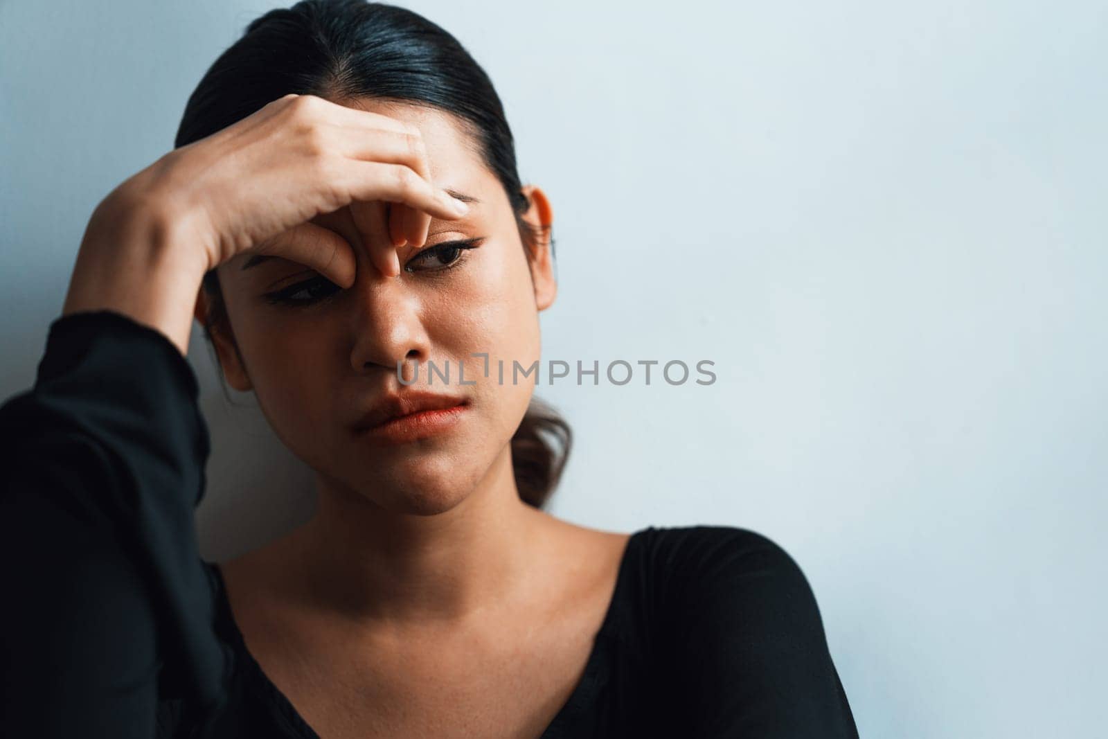 Depressed young Asian woman with mental health problem in mind need uttermost treatment from overthinking fatigue, disruptive thought, dissocial, anxiety and other mental health disorders .