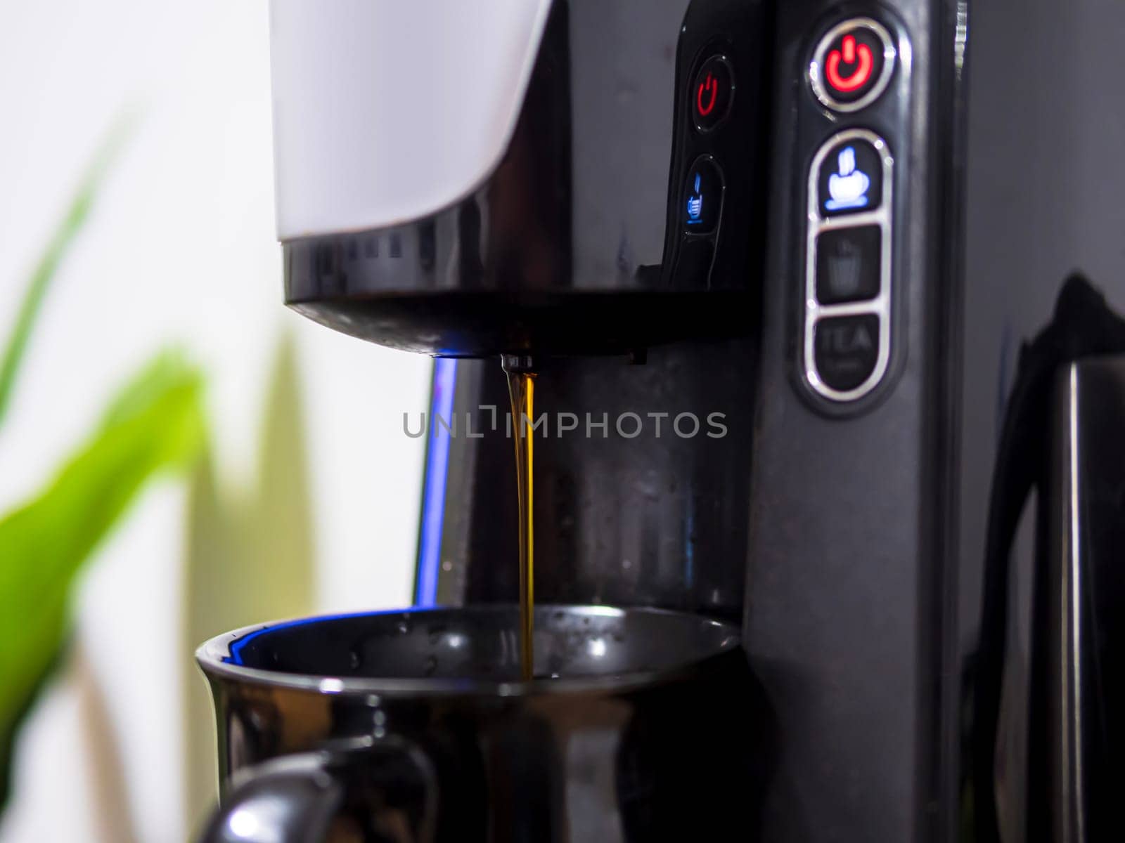 Coffee machine with capsule. Pouring coffee. Espresso machine making fresh coffee