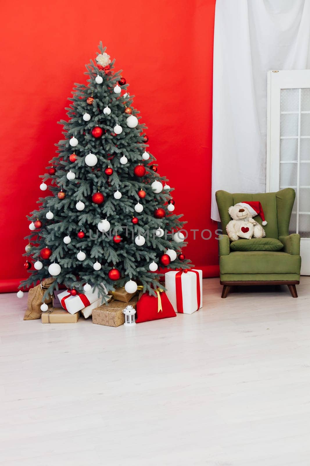 Decor Christmas blue Christmas tree with gifts and garlands interior