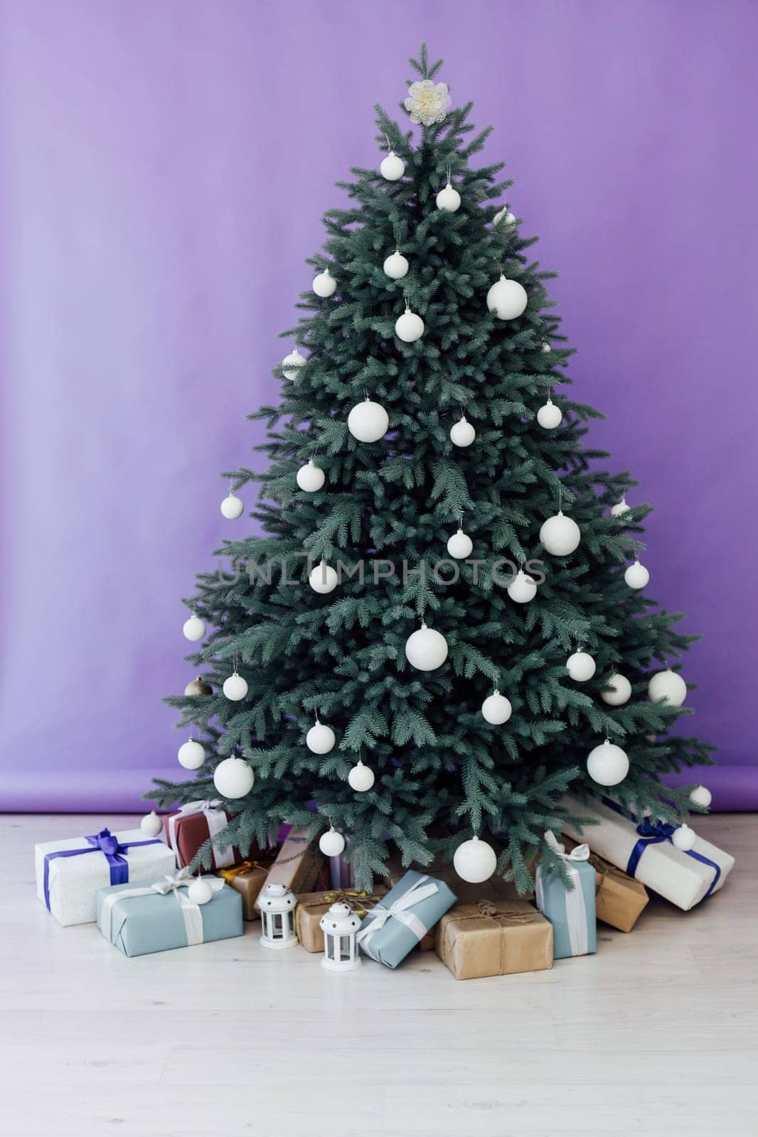 New Year's Christmas Tree with gifts and decor garlands