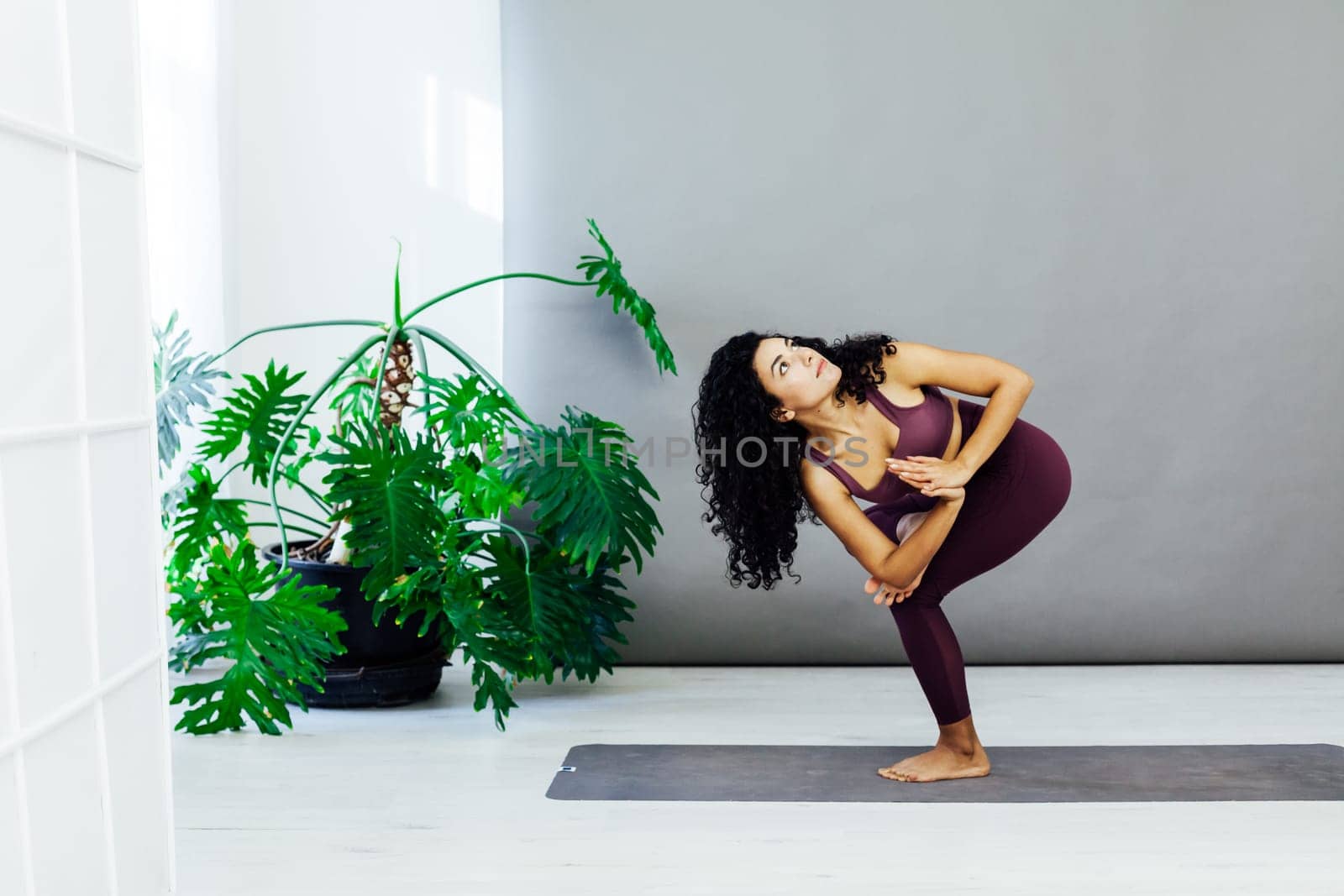 brunette woman engaged in yoga sports fitness asana body flexibility