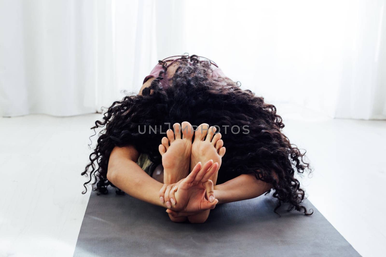 Female engaged in yoga fitness asana body flexibility