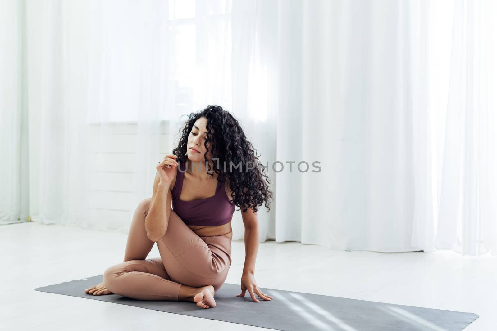 Beautiful female brunette sports yoga fitness body flexibility