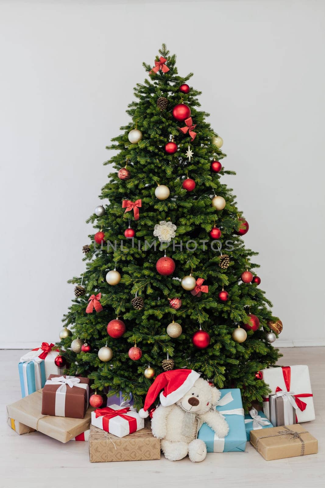 Christmas tree with presents underneath in living room